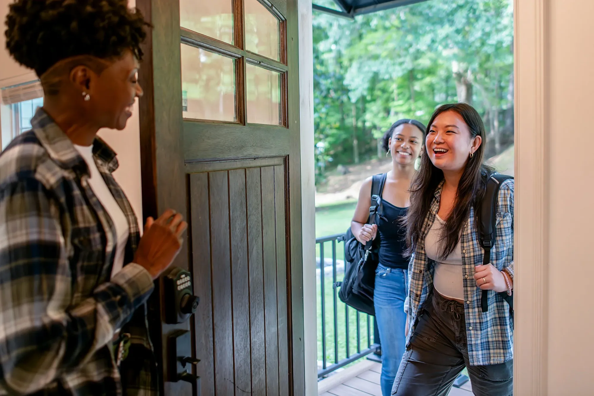 Two residents arriving home at a Providential co-living house in Allendale, Michigan